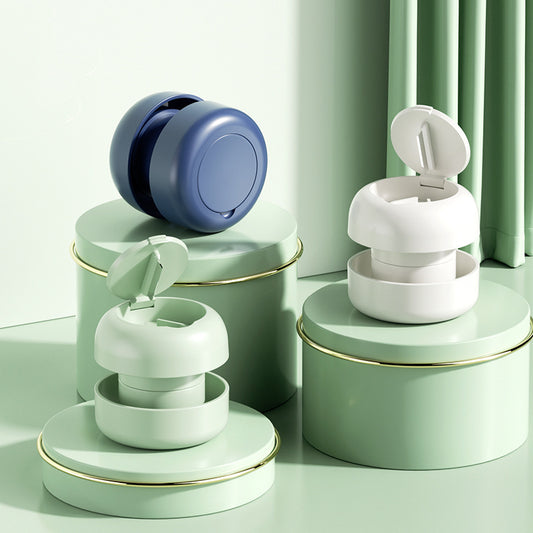 Pill cutter and grinder in green — compact mushroom design two-in-one tablet cutter