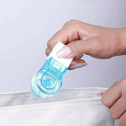 Pill taker tool showing collection cup — catches tablet without direct finger contact