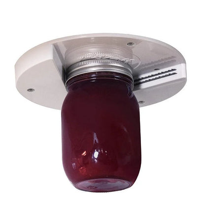 Under-cabinet jar opener fitted and in use — permanent hands-free kitchen aid for elderly